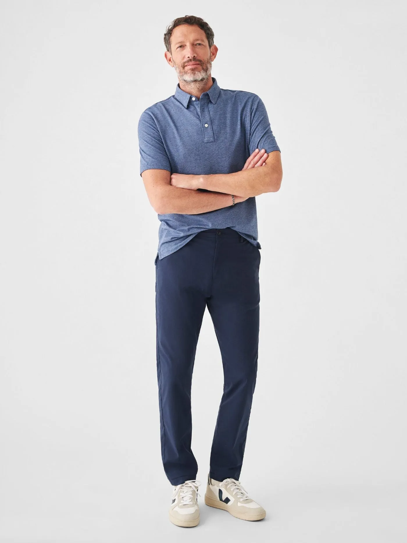 Faherty Short Sleeve Movement Polo in Sea Navy Melange