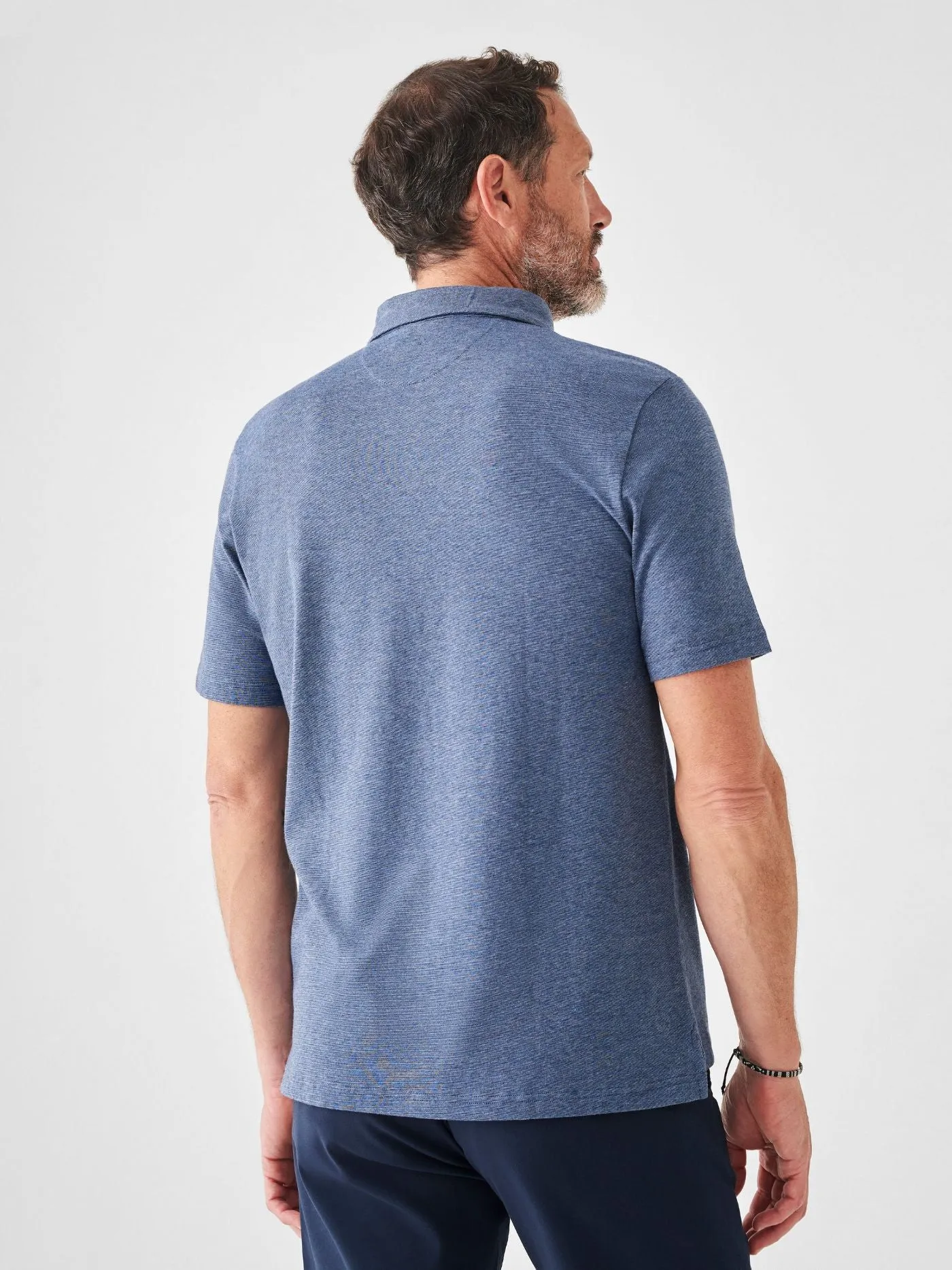 Faherty Short Sleeve Movement Polo in Sea Navy Melange